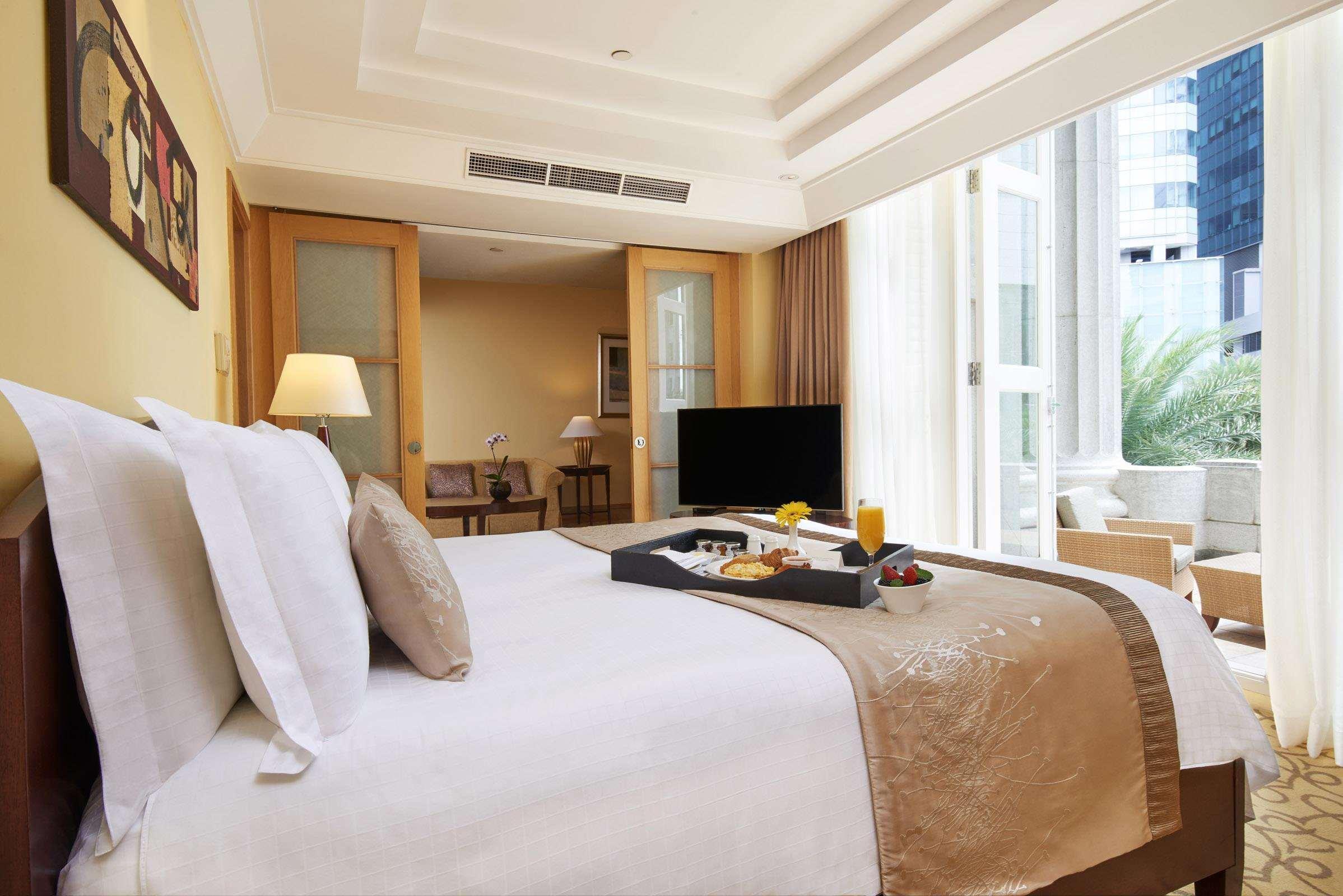 The Fullerton Hotel Σιγκαπούρη Εξωτερικό φωτογραφία A bedroom at the hotel